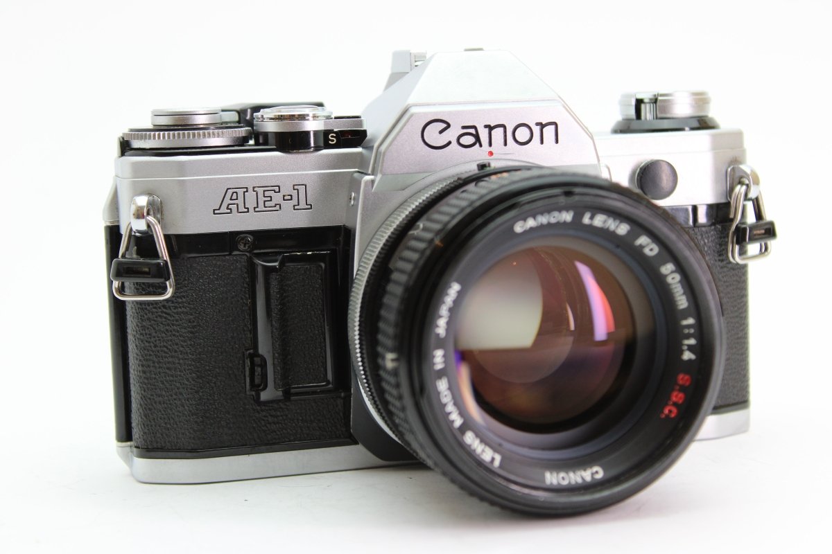 thumbnail image 2 of MINT Canon AE-1 Program 35mm SLR With NFD 50mm F/1.4 Lens – From Japan, W/ Strap & Caps 2 of 3