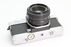 Minolta SRT 100x + 50mm f2 (#3099) - Minolta